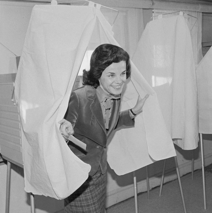 Then-San Francisco Mayor Dianne Feinstein emerges from a voting booth after casting her ballot in a 1979 runoff election between herself and supervisor Quentin Kopp.