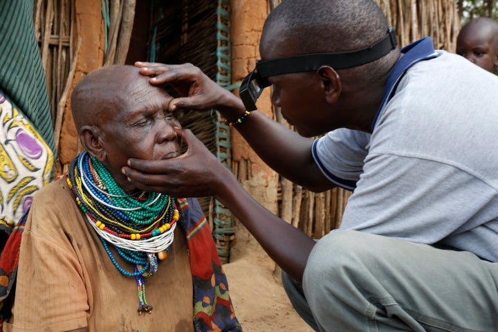 Itai Nakoru, 87, from Adengei village, Nakapiripirit District, Karamoja region, Uganda is examined to see if she is fit for e