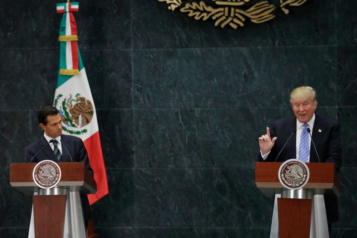 President Donald Trump insisted he would build a wall on the southern border of the U.S. and make Mexico pay for it, but he didn't discuss the topic when he appeared with Mexican President Enrique Peña Nieto, left, last summer.