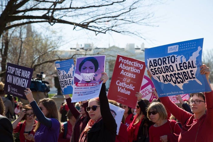 Protestors gathered outside the White House on International Women’s Day to resist Trump’s deadly global gag rule.