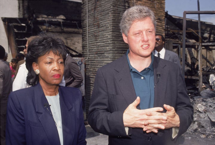 Then-Democratic presidential candidate Bill Clinton takes a tour of South Central Los Angeles with U.S. Rep. Maxine Waters on May 4, 1992.