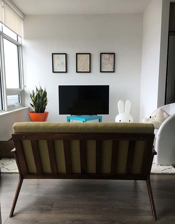 A mid-century modern loveseat is a great fit for a small apartment.