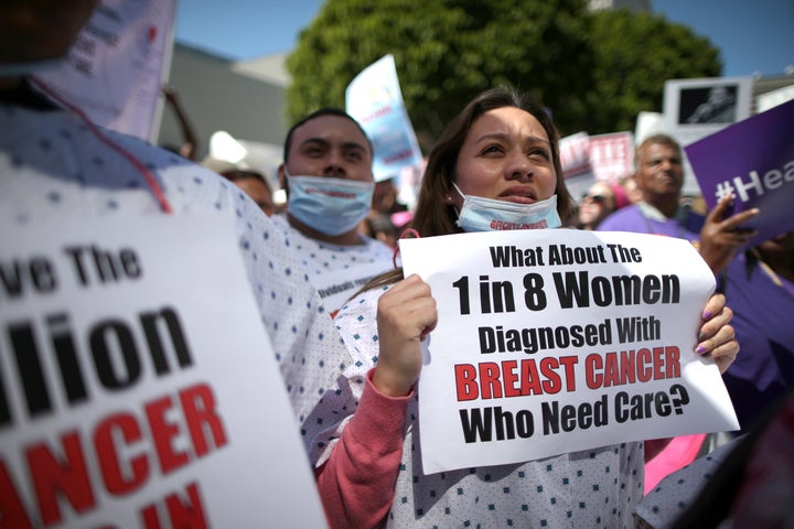 People march in a "Save Obamacare" rally on the seventh anniversary of Obamacare's signing, in Los Angeles, California, on March 23, 2017.