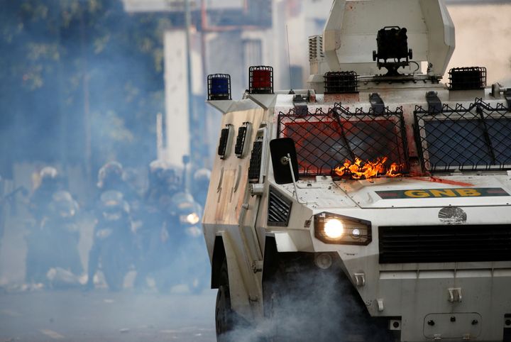 Opposition supporters threw molotov cocktails at a water cannon in Caracas. 