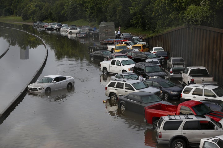 Vehicles are left stranded on a highway in Houston after torrential rains on May 26, 2015. Rainfall reached up to 11 inches in some parts of the state over the Memorial Day weekend. Rep. Smith said the disaster showed a need for better weather forecasting.