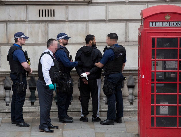 The man was handcuffed and detained against a wall on Whitehall, Westminster