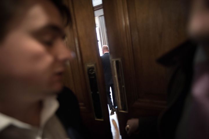 Nuttall is ushered into a room as he is pursued by journalists on Monday, who asked whether he would stand