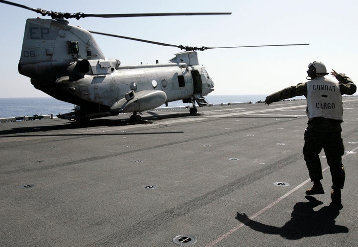 A CH-46E Sea Knight troop carrier, first used during the Vietnam war, before it takes off from the USS Essex in 201