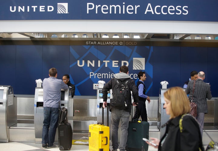 Travelers check in at a United Airlines counter at O'Hare International Airport in Chicago. The violent removal of a doctor from a United flight in Chicago in April was investigated by federal officials.