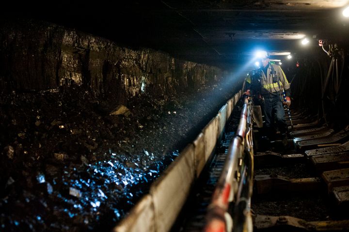 A new measure pushed by Rep. Tim Murphy (R-Pa.) could jeopardize efforts to finalize a separate provision that would permanently fund health benefits for retired United Mine Workers. Above, a coal miner shines his head lamp on coal transported on a conveyor belt at the Consol Energy Bailey Mine in Wind Ridge, Pennsylvania.