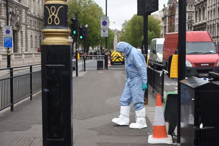 British police take security measurements near the Houses of Parliament in central London on April 27.
