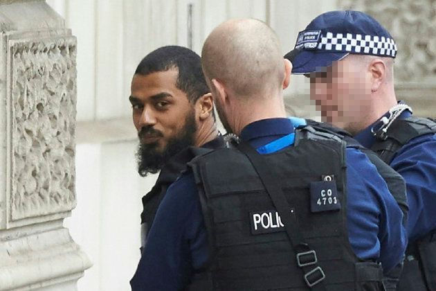 Police detain a man near Downing Street and Parliament on Thursday