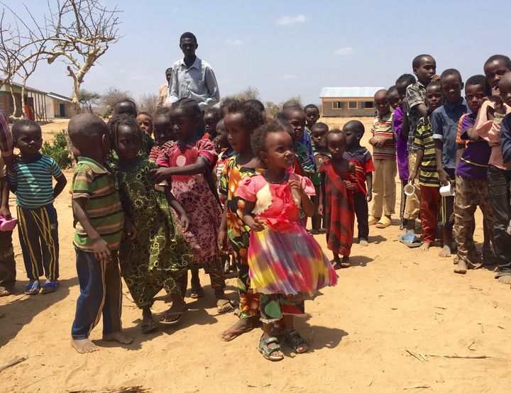 Children queue for a school meal in Marsabit County, Kenya. 3 March 2017
