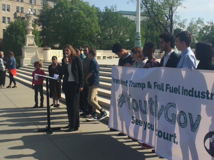 Speaking at the steps of the Supreme Court, alongside 14 of the 21 young plaintiffs in <em>Juliana v. U.S.</em>, suing the fe