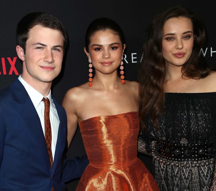 Selena Gomez with the show's stars Dylan Minnette and Katherine Langford. 