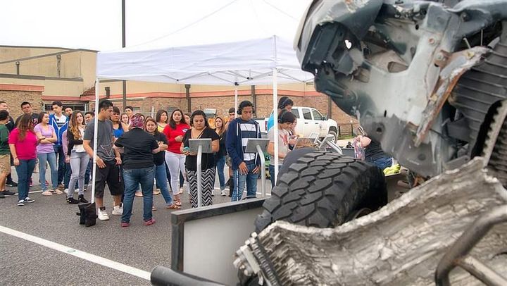 Students from Harlingen High School South in Texas view the remains of a truck demolished in a crash in which two teens survived because they were wearing their seat belts. Nearly three-dozen states allow police to stop a vehicle and ticket motorists solely for not wearing a seat belt.