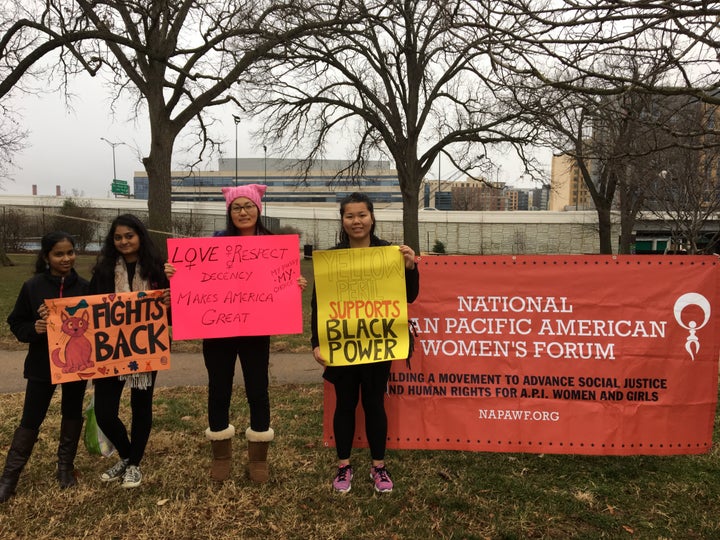 NAPAWF members gather with signs before the Women’s March in Washington, D.C.