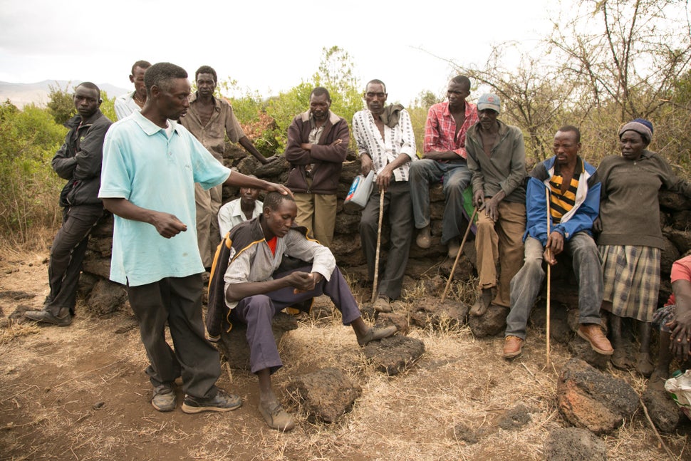 Community health worker Joseph Kariuki advises people who live in the Utut Forest to seek medical treatment, rather than use
