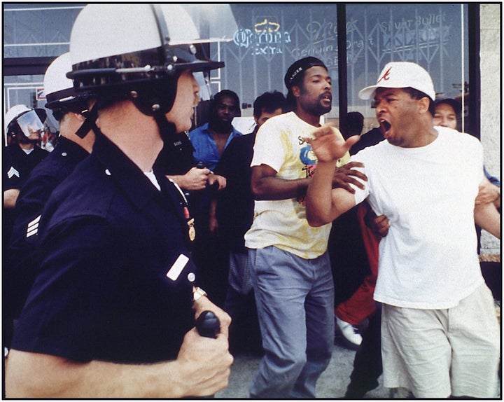 An argument between police and civilians preceding a rock and brick throwing incident at the corner of Vermont and 1st Street on April 29, 1992 in Los Angeles, California.