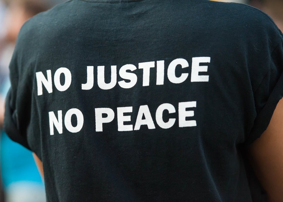 A protester wears a T-shirt proclaiming