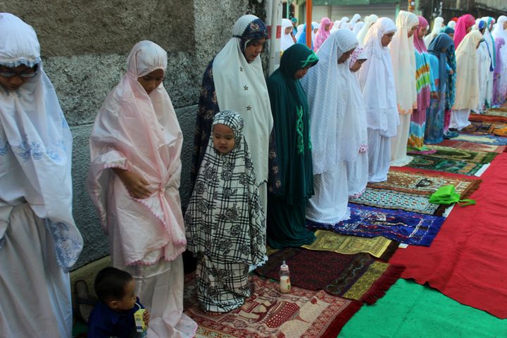 Muslim women join together to pray Eid al-Adha in the area of Kebayoran Lama, Jakarta, on Sept. 12, 2016.