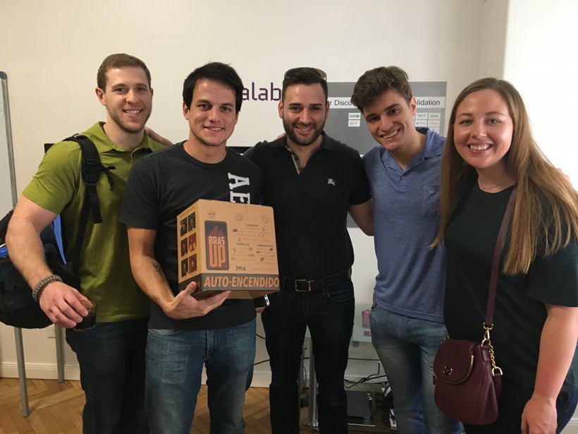 Weatherhead MBA students Alec Janda, Giancarlo DiFranco, and Michelle Miller with the BrasUp team at Scalabl