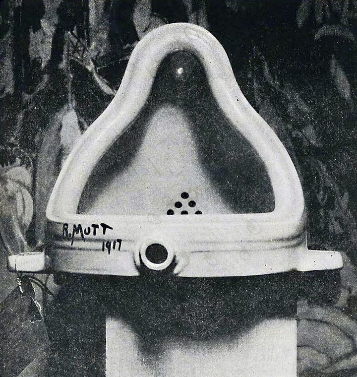 The original Fountain by Marcel Duchamp photographed by Alfred Stieglitz at the 291 (Art Gallery) after the 1917 Society of Independent Artists exhibit. Stieglitz used a backdrop of The Warriors by Marsden Hartley to photograph the urinal. The entry tag is clearly visible. (Image and text: Wikipedia)