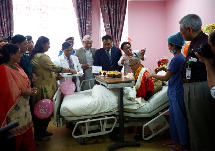 Taiwanese hiker Liang Sheng Yueh, who was lost in the Himalayas for over a month, celebrates his 21st birthday at a hospital after being rescued in Kathmandu, Nepal April 28, 2017.