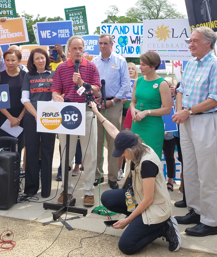 Democracy Now!’s Amy Goodman records Cong. Nydia Velázquez of New York, Sen. Maria Cantwell of Washington, Sen. Sheldon Whitehouse of R.I., Sen. Jeff Merkley of Oregon, Attorney General Maura Healey of Mass., Sen. Tom Carper of Delaware and Sen. Ed Markey of Mass. at the Peoples Climate March, D.C.