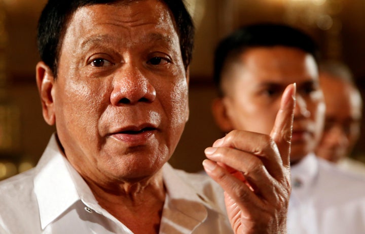 Philippine President Rodrigo Duterte talks to reporters after a news conference at the presidential palace in Manila, Philippines March 13, 2017.