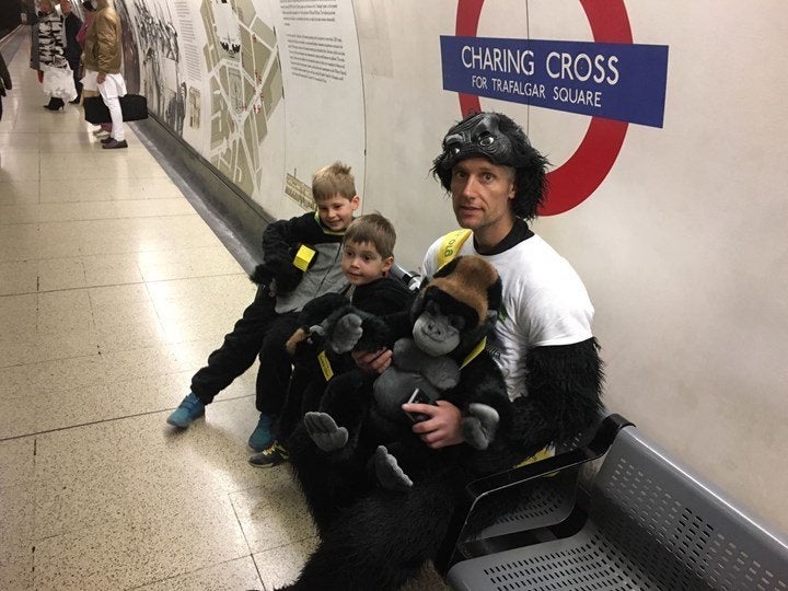 Harrison is seen with his two young sons. The 41-year-old completed the London Marathon on Saturday in a gorilla costume.