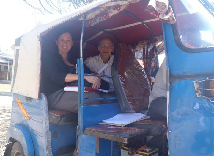 Traveling between household visits by Tuk Tuk.