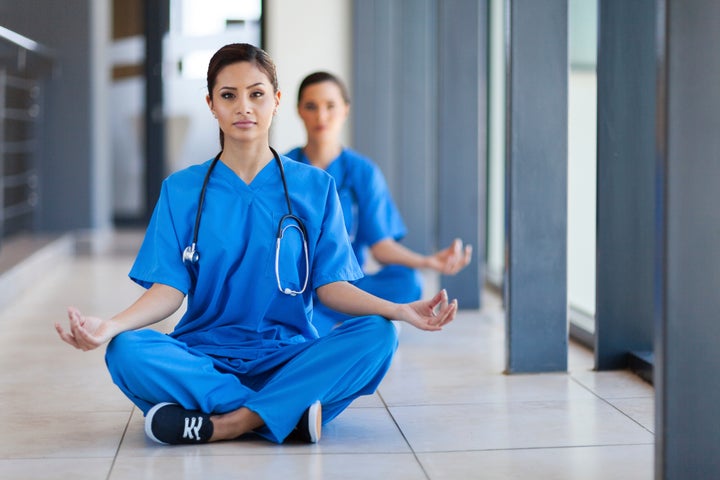 <p>Nurses meditating</p>