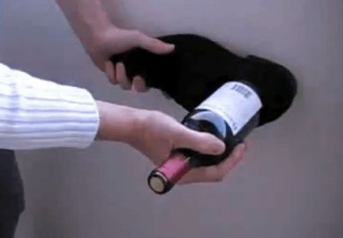Open a wine bottle using a shoe.