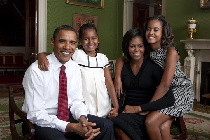 The Obamas pose for a portrait in the Green Room of the White House in 2009.