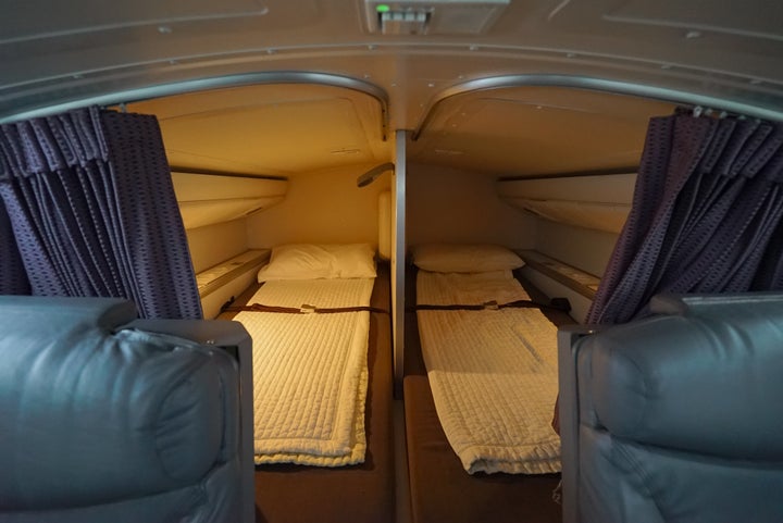 Meanwhile, pilots rotate resting in two beds above the business class cabin, which come with access to in-flight entertainment. 