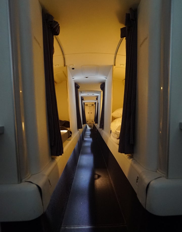 After meal service, flight attendants on Virgin Australia flights take turns using eight beds in the rest area above the economy cabin. 