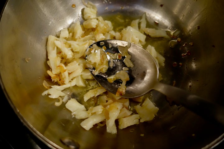 <p>Baccalà added to the aromatics, white wine to come</p>