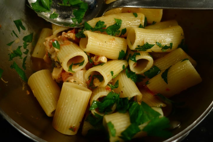 <p>Rigatoni added to the pan, then lots of parsley</p>