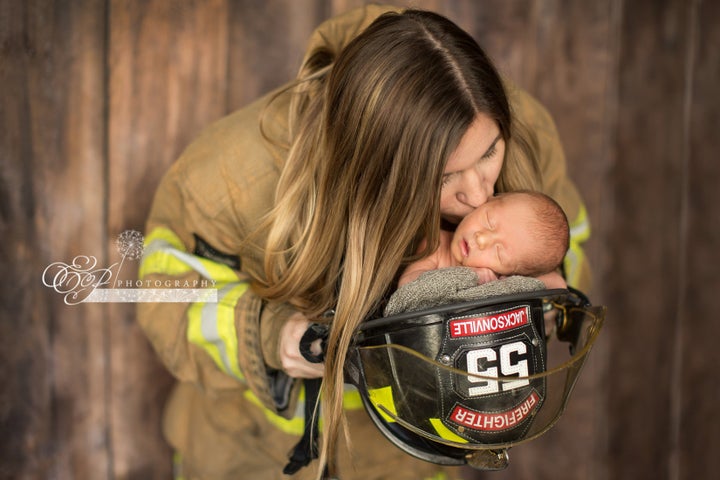 firefighter carrying baby