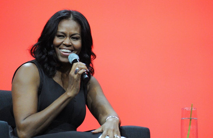 Former first lady Michelle Obama smiles during a conversation at the AIA Conference on Architecture 2017 on April 27 in Orlando, Florida.