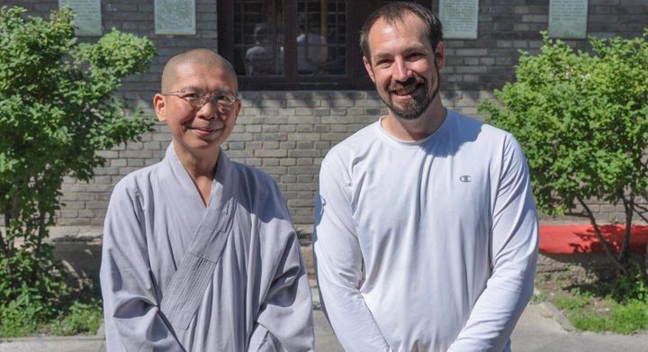 Justin Whitaker, co-founder of GuideFul (right) with his friend Ven Jin Ho (right) in China.