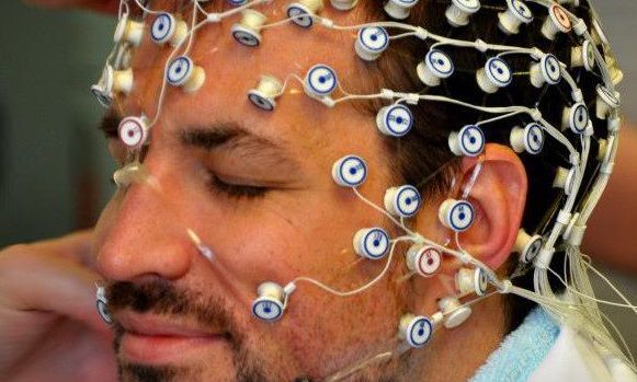 Whitaker getting geared up for an EEG for a study on meditation, attention, and emotions.