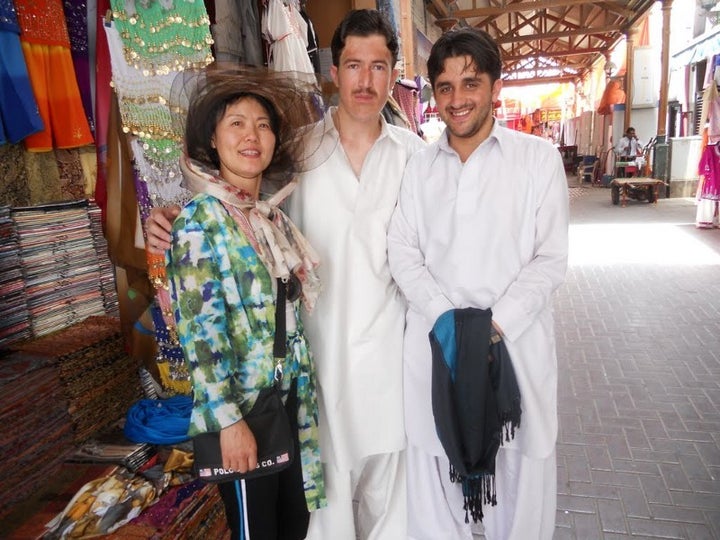 My mom with slightly confused but happy shopkeepers in Dubai. Complete with awkward arm wrap.