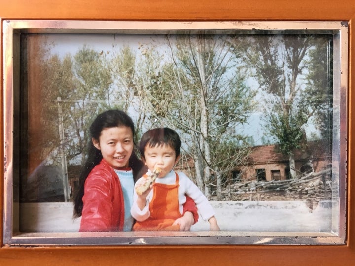 <p>Photo taken by my dad of me and my mom at his labor camp in 1986, 10 years after leaving it. I’m sucking on a sugar cane.</p>