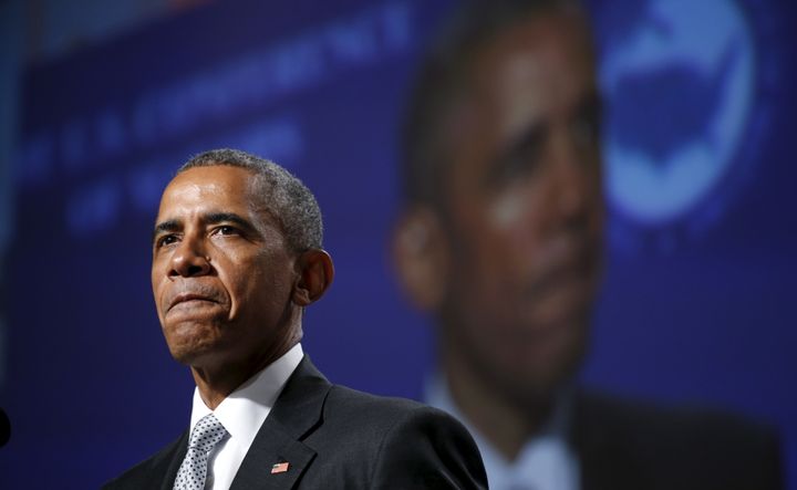 President Barack Obama pauses while speaking about gun violence during an address to the U.S. Conference of Mayors.