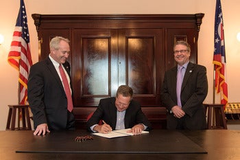 <p><em>Why are John Kasich, center; Ohio Senate President Keith Faber, left, and I smiling? The governor signed Faber’s excellent bill to improve Ohio’s open records laws last spring.</em></p>