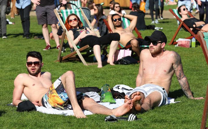 Hopes of a May heatwave have been dashed by the Met Office; sunbathers are pictured about in Green Park, London, last month