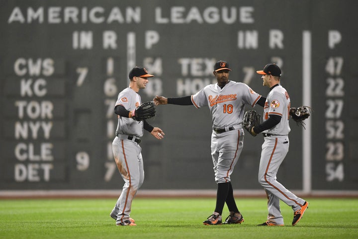 Adam Jones (10) celebrates a victory over the Boston Red Sox after bigoted fans taunted him.