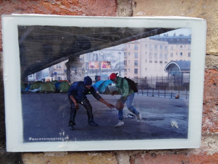 Shooting hoops in a French migrant camp.